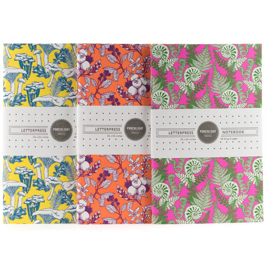 Set of 3 pocket notebooks with colorful illustrated forest foraging covers