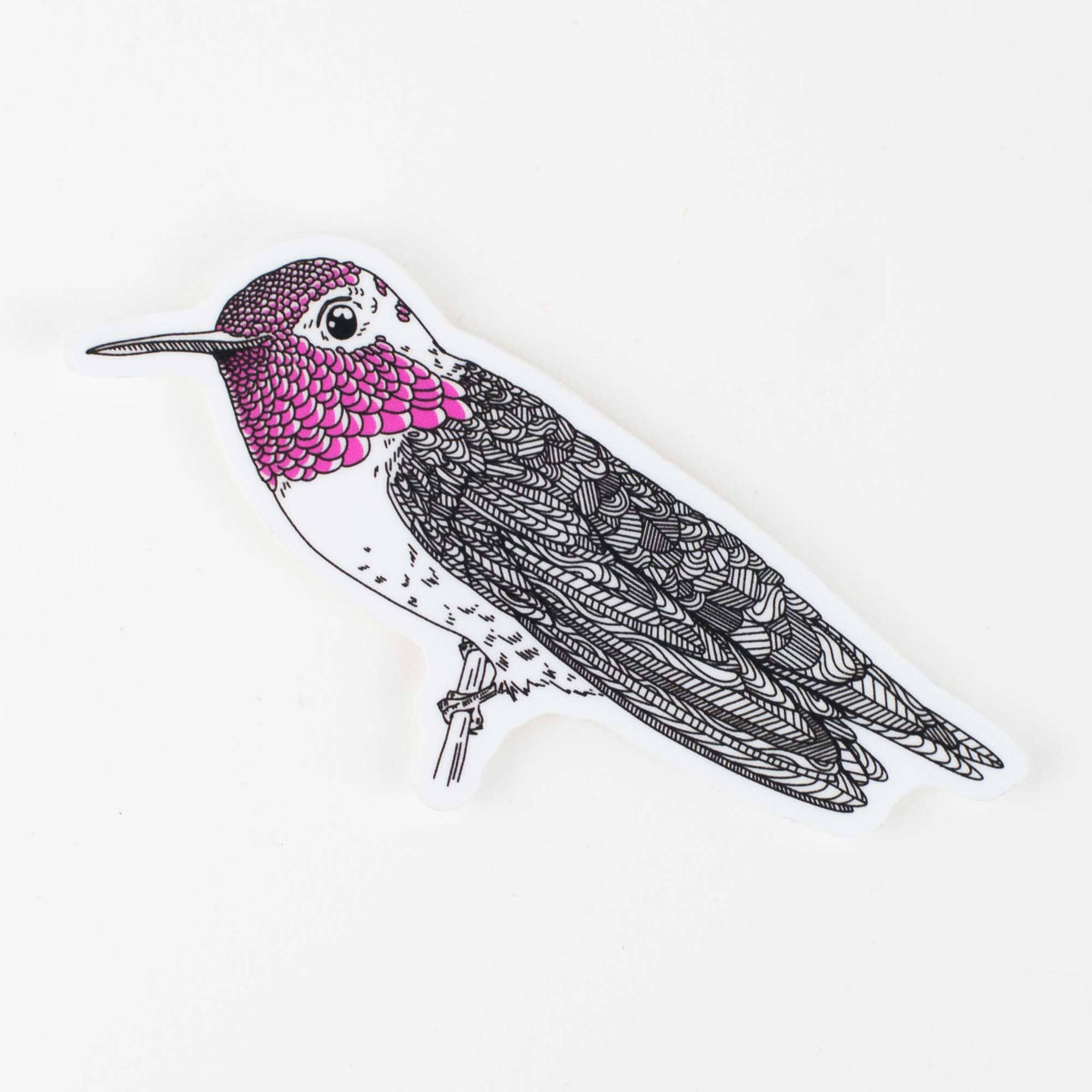 Hummingbird sticker with purple and pink head, black-and-white detailed wings, die-cut shape