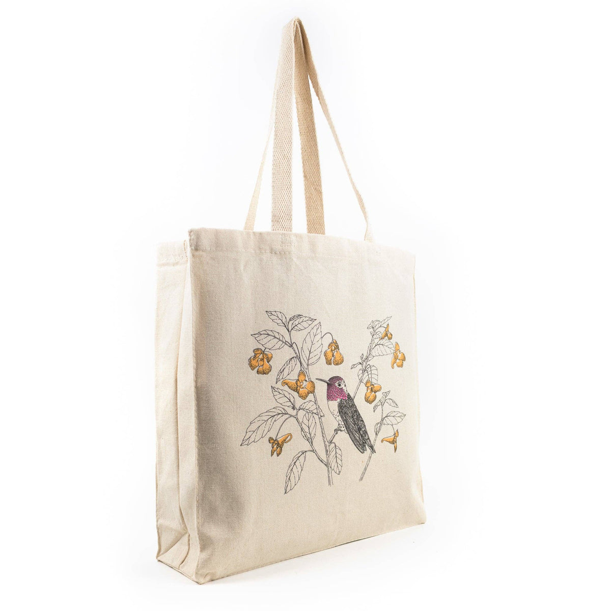 Off-white canvas tote bag with hummingbird and botanical letterpress-style artwork
