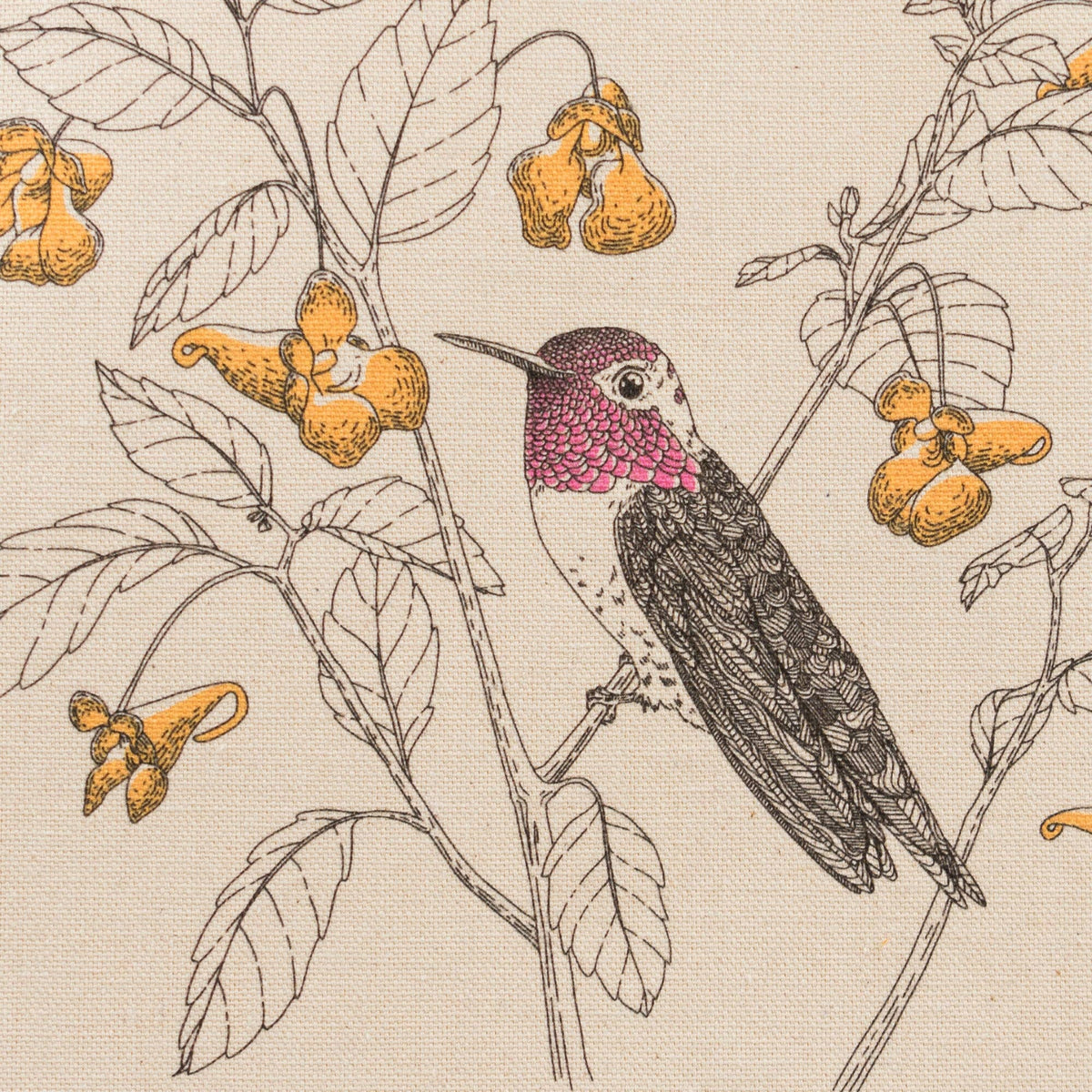 Close-up of off-white canvas tote print with hummingbird, leaves, and yellow flowers